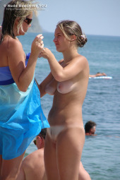 Nudists beach crowded with young bodies