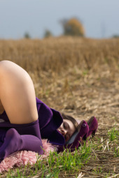 Stripping purple outfit with purple pantyhose in the field